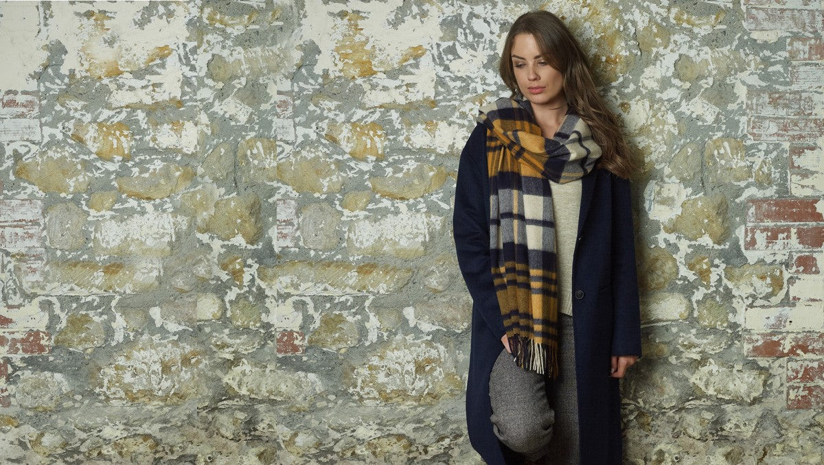 Load video: Glen Prince Scarves and stoles inspired by Scottish heritage and defined by contemporary British elegance. Exceptional materials, including the finest cashmere, for a timeless expression of style.